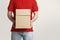 Online shopping, shipping and courier. Deliveryman n uniform holds boxes