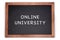 Online university written on chalkboard, white background