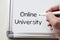 Online university written on whiteboard