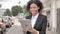 Online Video Chat on Tablet by African Businesswoman, Standing Outdoor by Road