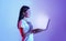 Online work and education. Girl holding laptop with glowing screen