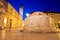 Onofrio Fountain and Stradun street in Dubrovnik evening view