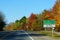 Ontario, Canada - October 28, 2019 - The view of the road towards Ivy Lea and Gananoque with striking fall foliage