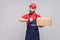 Ontime delivery service! Young logistic man with beard in blue u