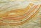 Onyx texture background of natural stone with polished orange streaks. marble texture used for indoor and outdoor home decoration