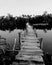 Ooden fisherman jetty with cloudy sky.