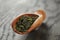 Oolong green tea in wood scoop