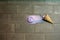 Oops pink ice cream fell down on the ground. Flat lay