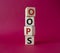 Oops symbol. Concept word Oops on wooden cubes. Beautiful red background. Business and Oops concept. Copy space
