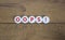 Oops symbol. Oops sign on white circles. Beautiful wooden background, copy space. Business and oops concept