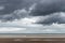 Oostduinkerke, Belgium - Octobr 23, 2020: Nice view of the North Sea beach under heavy clouds
