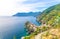 Op aerial view of Vernazza typical village with colorful buildings houses, Castello Doria castle on rock cliff and Genoa Gulf, Lig