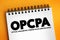 OPCPA - Optical Parametric Chirped Pulse Amplification acronym text on notepad, abbreviation concept background