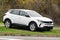 Opel Grandland small crossover with white colour parked in front of dealership