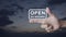 Open 24 hours flat icon on finger over sunset sky, Business full time service concept