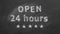 Open 24 hours written with chalk on blackboard