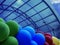 Open-air concert on a stage decorated with balloons.