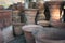 Open air workshop of ceramics, earthenware, orange and brown terracotta flower pots