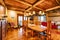 Open and airy dining room featuring large windows along the walls and chairs gathered around a table