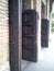 Open antique wooden doors in a church. Solid oak and particle walls