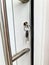 Open apartment door with a key in the lock - security and protection against burglary