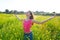 Open arms happy teen girl in spring meadow