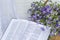 Open Bible and bouquet flax in wicker