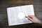 Open Bible. Magnifier in hand. On the table. Holy Bible, Scripture. Magnifier