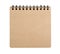 Open blank square notebook from brown craft paper with a spiral lies on a white background
