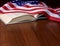 Open book with the American flag on the table frame stock images