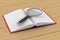 Open book and magnifier on white background. 3D illustr