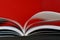 Open book on red background