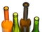 Open bottlenecks of colored wine bottles close up