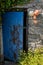 An open broken painted door held open with a piece of string of a traditional stone building in Ireland