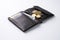 Open brown leather wallet with dollar cash, coins, debit credit cards