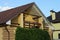 Open brown wooden balcony with flowerpots