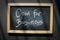 Open for business - words written with chalk on blackboard