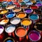 Open cans of paint in many colors, representing diversity and choice