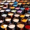 Open cans of paint in many colors, representing diversity and choice