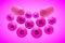 Open capsule with essential vitamin pills on pink background. Vitamin and mineral complex. Healthy life concept. Medical