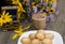 Open casket, cappuccino, plate with cookies and wild flowers on