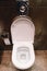 Open ceramic toilet bowl