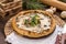 Open chicken mushroom pie with ingredients on wooden table
