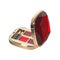 Open cosmetic set with lipstick and applicators in red golden plastic case