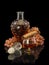 Open decanter and glass filled with cognac, cigar and bunch of grapes