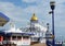 Open deck of Eastbourne pier with seating and arcade entertainment