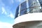 Open deck luxury cruise liner, against the blue sky, a view of the glass fence below