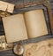 Open diary top view with old treasure map and compass