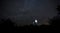 Open dome of a small telescope in an observatory in the background of the starry sky