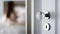 Open door into room, defocused view of woman in a bedroom interior, home decor and lifestyle